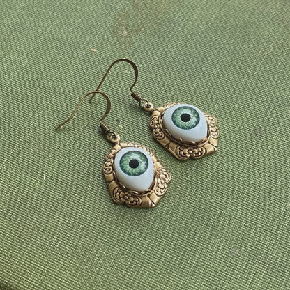 antiqued brass vintage-style oval green dolls evil eye drop dangle earring charms all seeing eye