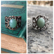 Antiqued brass and silver adjustable vintage style filigree stone ring with green oval mineral.