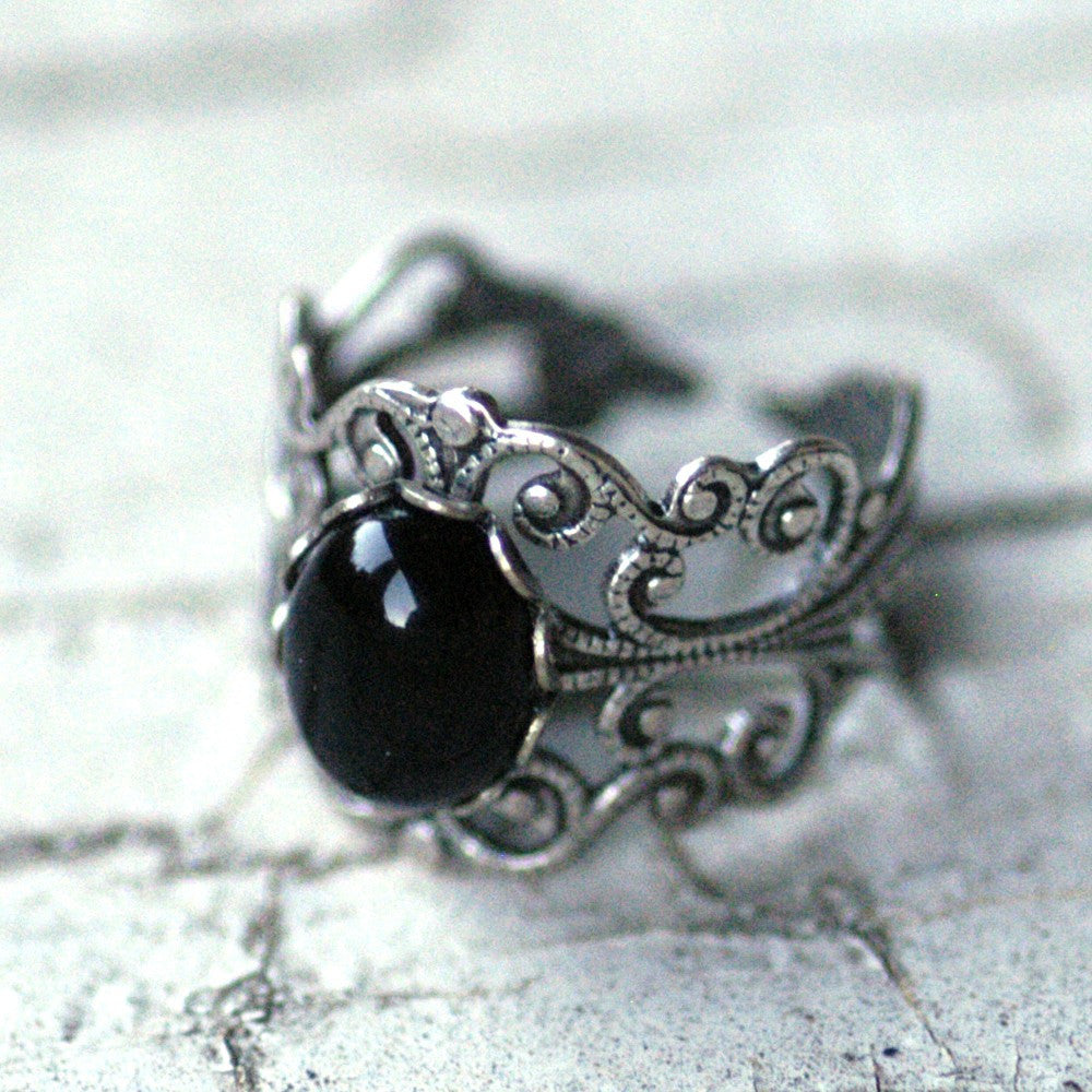Men's silver ring with black onyx stone engraving the word patience