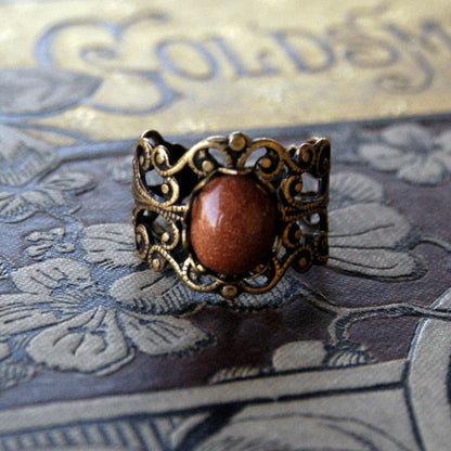 Goldstone and Brass Filigree Ring