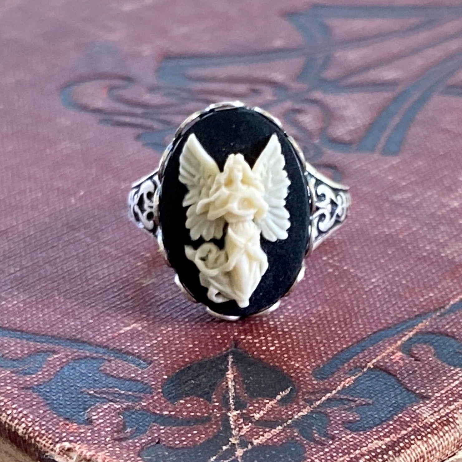 Antiqued silver retro vintage style adjustable ring with black and white angel cameo ring.