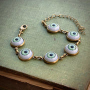 Eye Ball Bracelet in Antiqued Brass- choose green, brown or blue eyes.