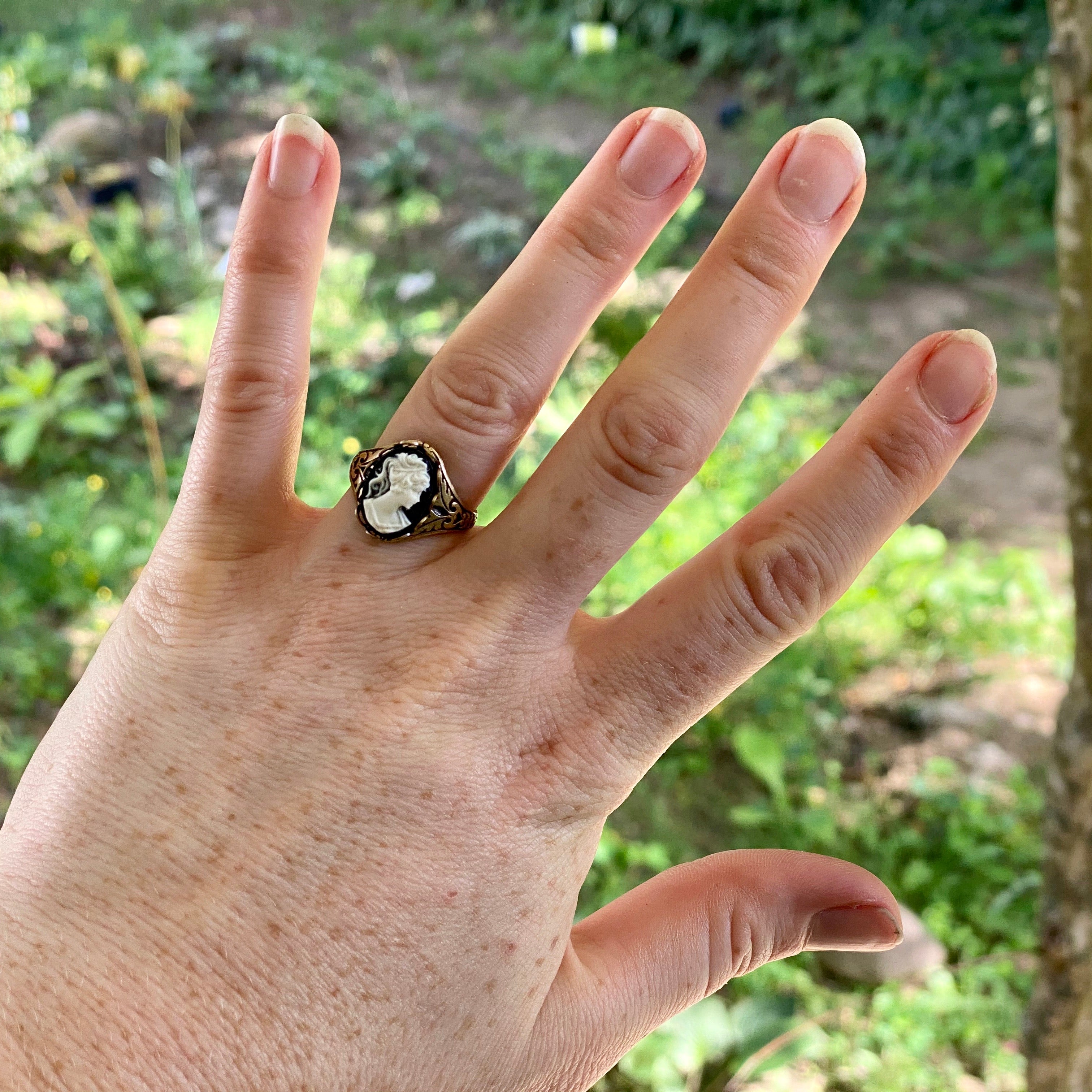 Antiqued brass vintage style adjustable ring with black and white cameo lady