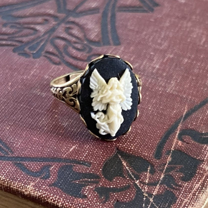 Antiqued brass retro vintage style adjustable ring with black and white angel cameo ring.