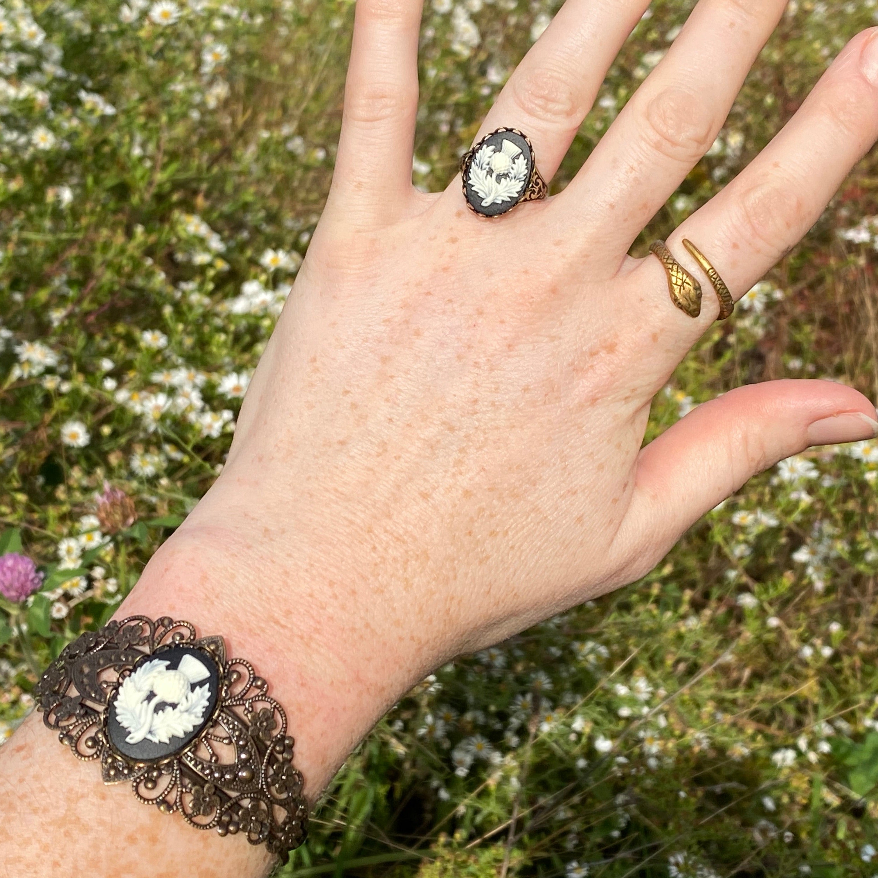 Antiqued brass bronze tone vintage style Victorian adjustable bracelet cuff with a black and white Scottish thistle cameo with matching adjustable ring.