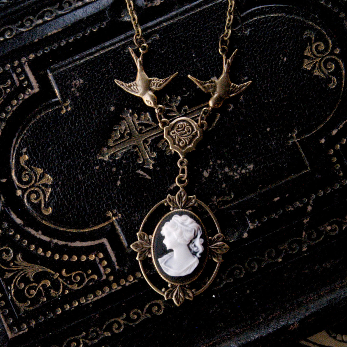 Antiqued brass Victorian lady white on black cameo necklace on a chain with birds.