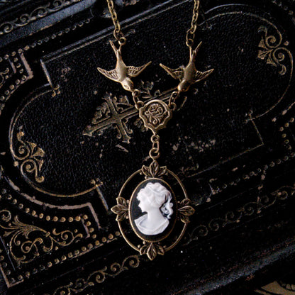 Antiqued brass Victorian lady white on black cameo necklace on a chain with birds.