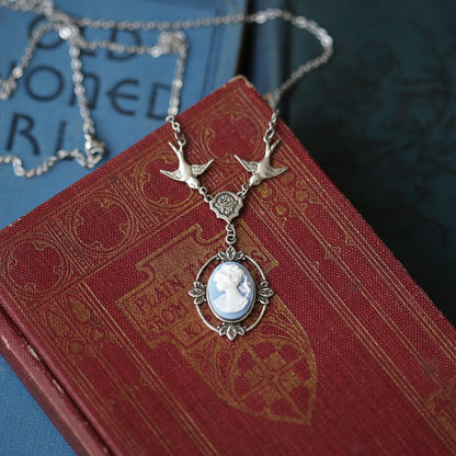 Antiqued silver Victorian lady white on blue cameo necklace on a chain with birds.