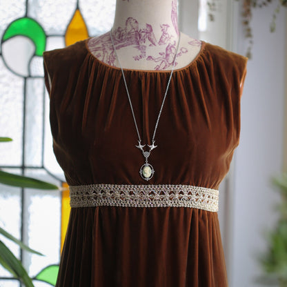 Antiqued silver Victorian lady white on green cameo necklace on a chain with birds.