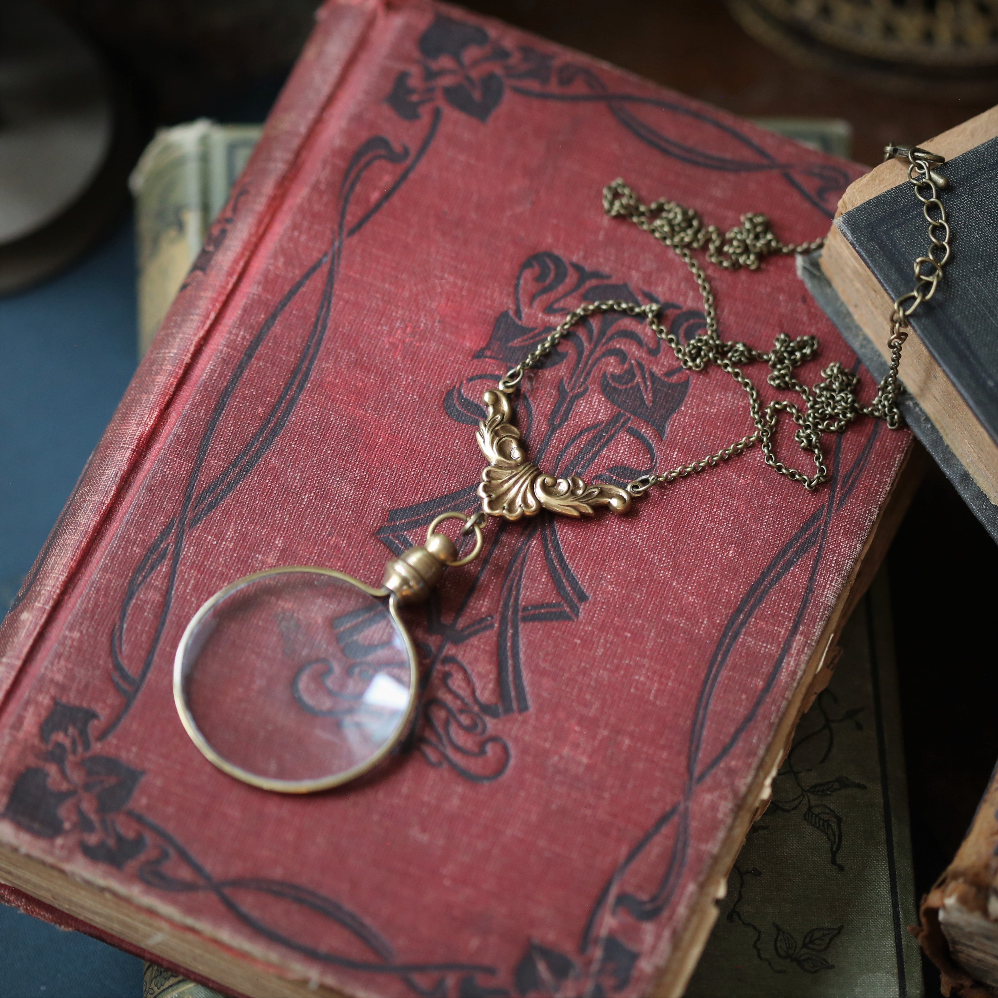 antiqued brass modern vintage inspired round looking glass 5x monocle pendant long necklace with leaf flourish chain a useful gift for crafter.