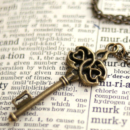 Antiqued brass infinity and hearts key pendant.