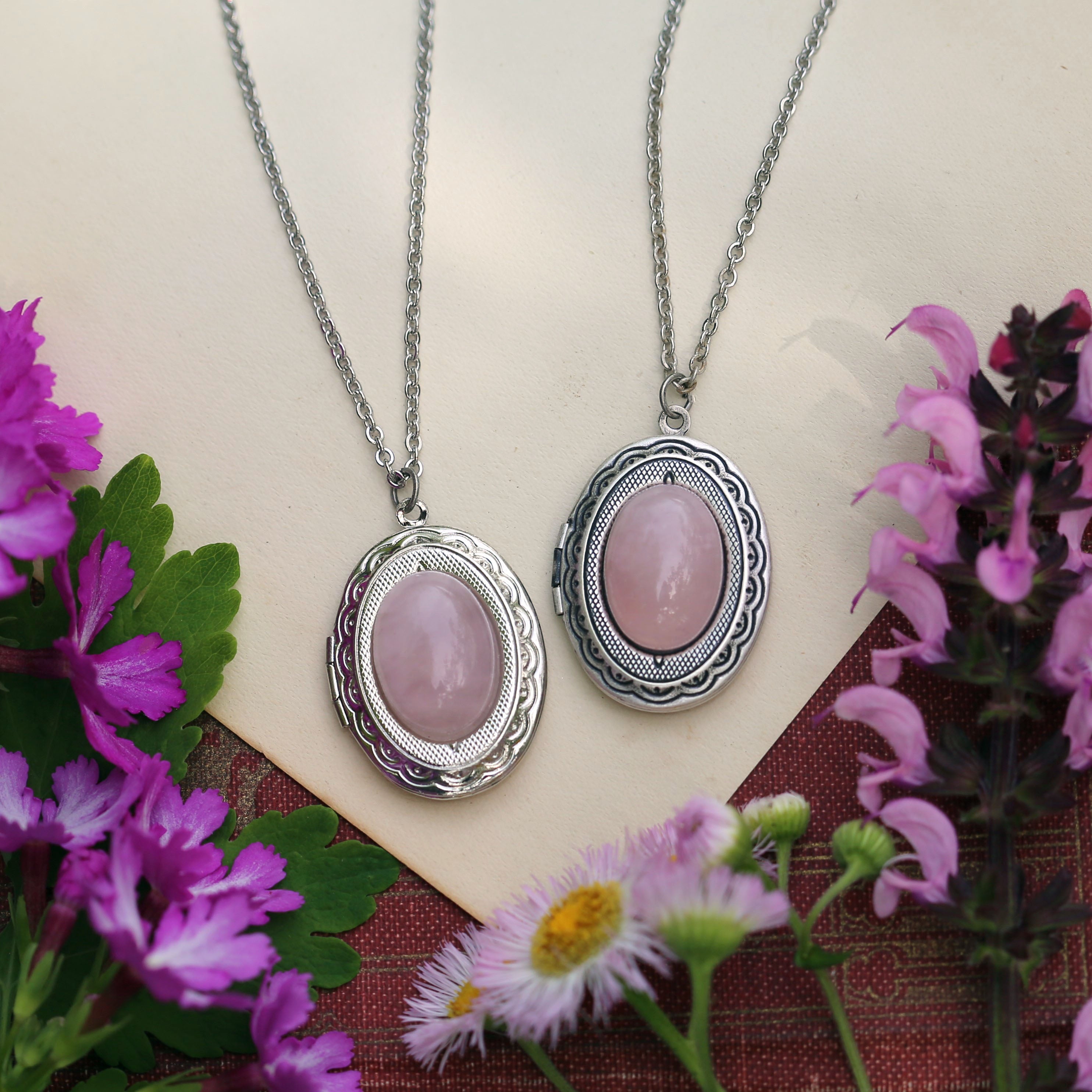 antiqued silver modern vintage style oval locket with a pink rhodonite or rose quartz in the coquette or pink pilates princess style