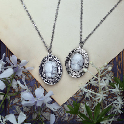 antiqued silver white goth or winter academia style howlite stone oval locket long necklace