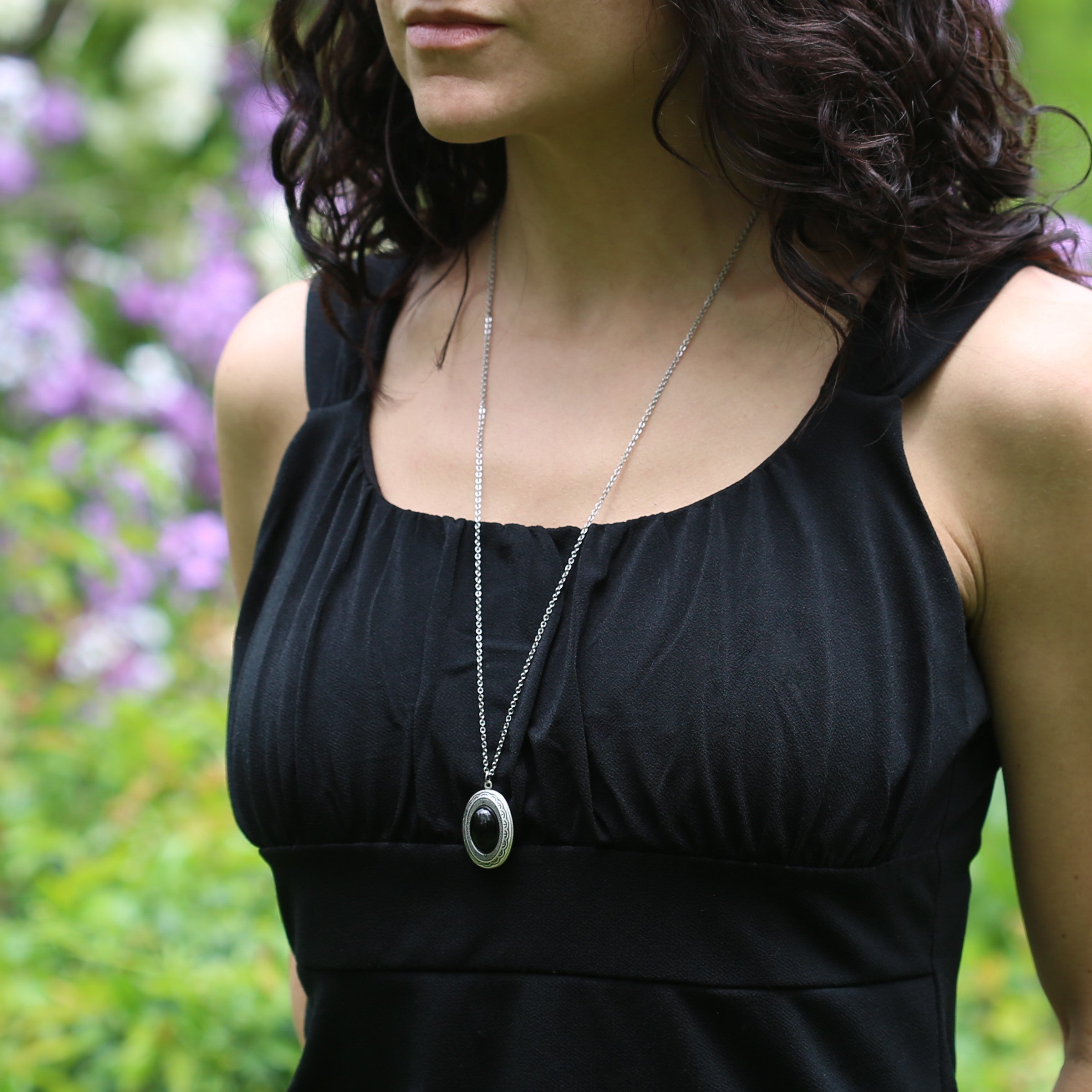 antiqued silver locket on 28 inches of chain modeled
