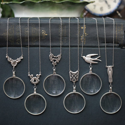 antiqued silver vintage style monocle magnifying glass useful necklaces with various Victorian style filigree.