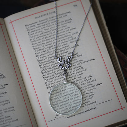 antiqued silver vintage style monocle magnifying glass useful necklace with swan wing filigree.