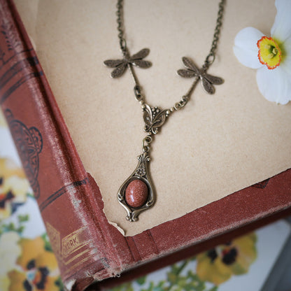 antiqued brass vintage-style dragonfly and orange sunstone mineral pendant drop necklace in autumn fairy core style