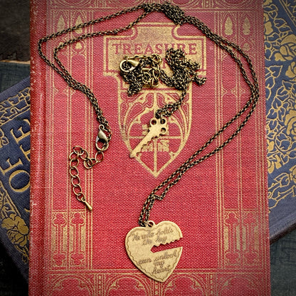 Antiqued brass necklaces. One with a key pendant and the other with a heart-shaped pendant with a key-shaped cutout.