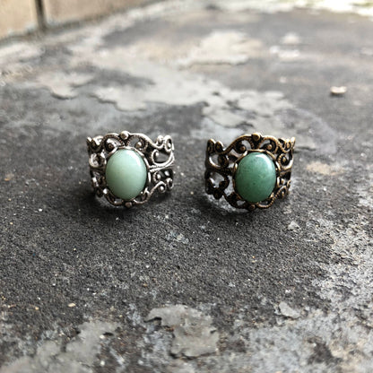 Antiqued brass or silver modern vintage inspired adjustable filigree cocktail ring with a green aventurine semi-precious stone in the cabincore style.  