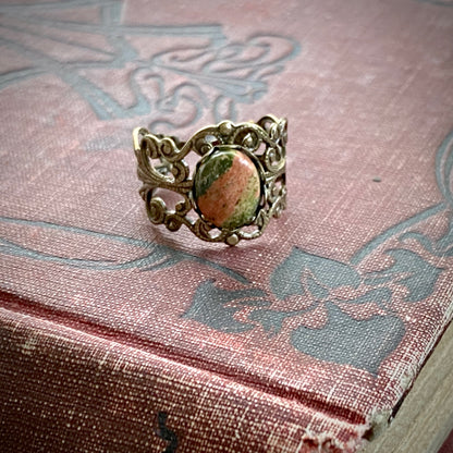 Antiqued brass modern vintage inspired adjustable filigree cocktail ring with orange and green unakite semi-precious stone oval mineral in a art ho aesthetic