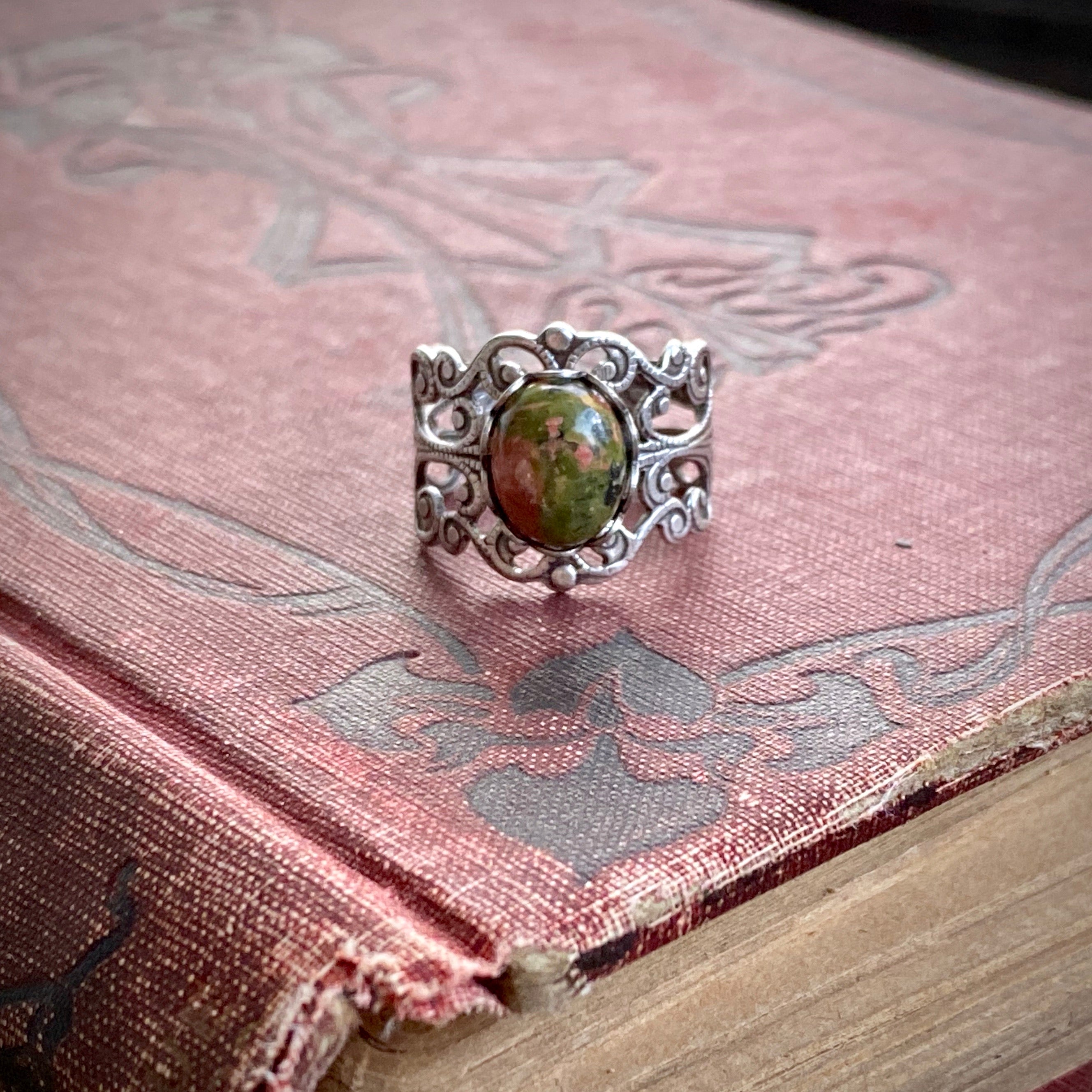 Antiqued silver modern vintage inspired adjustable filigree cocktail ring with orange and green unakite semi-precious stone oval mineral in a winter academia aesthetic