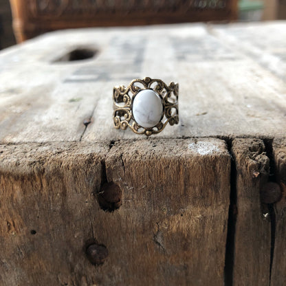 rich bronze colored antiqued brass modern vintage inspired adjustable filigree ring with a white marble howlite semi-precious mineral oval stone in the twee aesthetic
