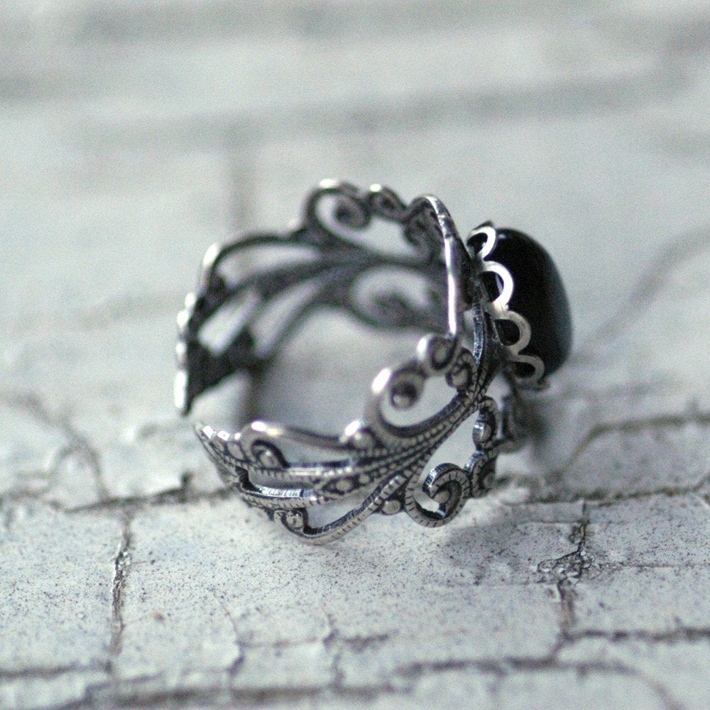 Antiqued silver modern vintage inspired adjustable filigree statement ring with a black oval onyx semi-precious stone mineral cabochon in acubi style