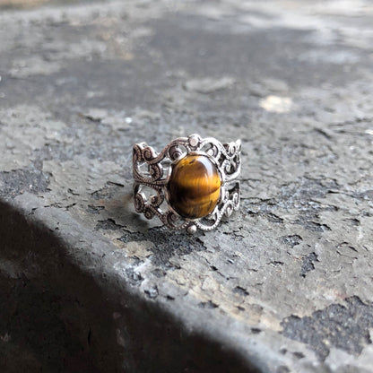 antiqued silver mod vintage inspired resizeable filigree ring with brown oval tiger eye semi-precious stone mineral perfect for a golden hour outfit.