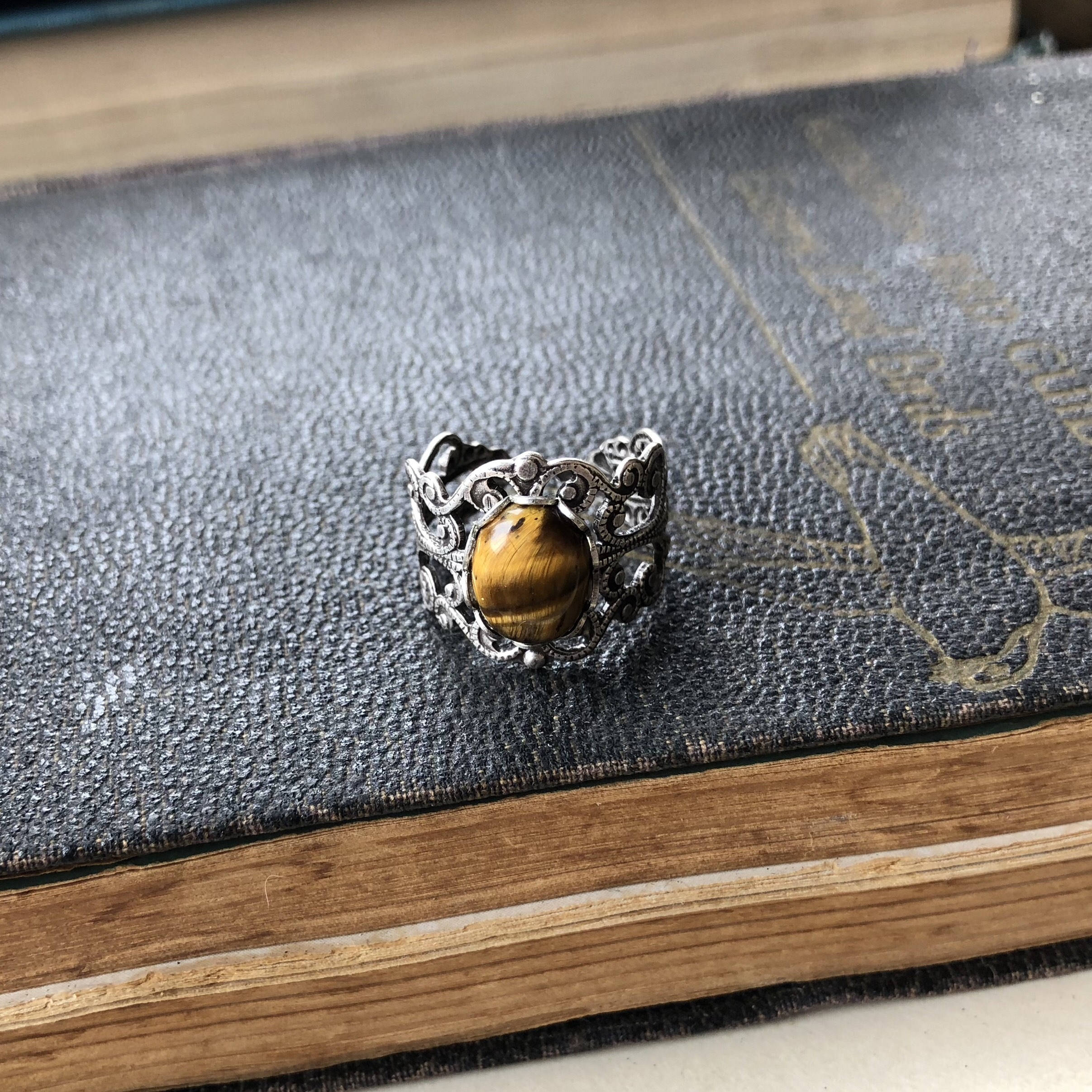 antiqued silver mod victorian inspired adjustable filigree ring with brown oval tiger eye semi-precious stone mineral perfect for a bookstore girl outfit.