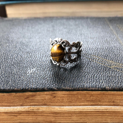 antiqued silver mod vintage inspired resizeable filigree ring with brown oval tiger eye semi-precious stone mineral perfect for an new england aesthetic outfit.